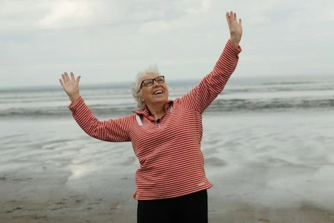Smiling older woman at the beach