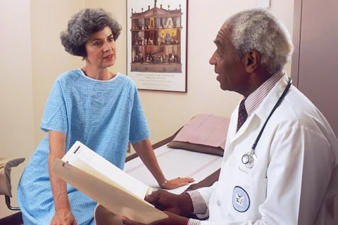 Clinician helping a patient in early recovery